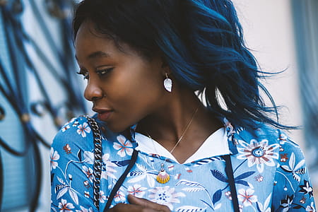 Woman Wearing Blue and White Floral Shirt thumbnail