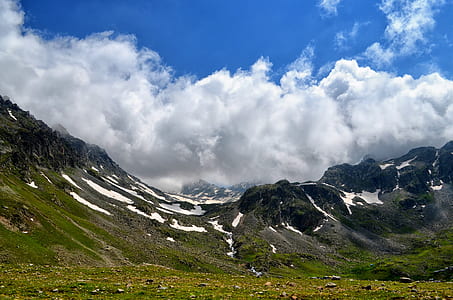 green mountains covered by snow at daytime thumbnail