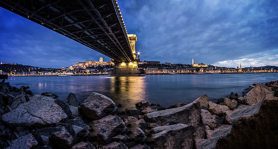View of Rocky Shore Under Bridge thumbnail