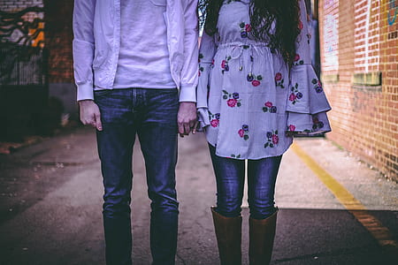 man and woman standing beside each other thumbnail
