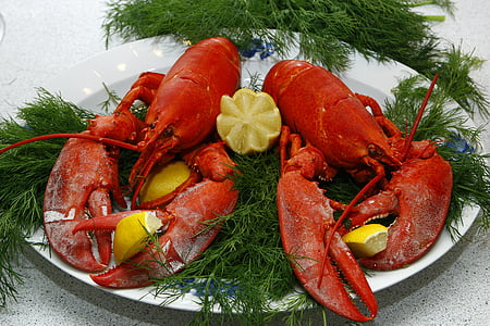 cooked lobsters with sliced limes thumbnail