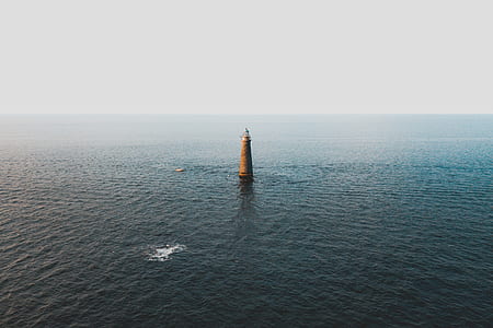 brown concrete structure in middle of water thumbnail