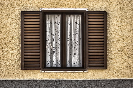 closed brown wooden framed window thumbnail
