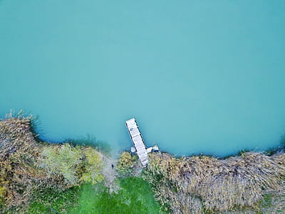 aerial view photography of white dock during daytime thumbnail