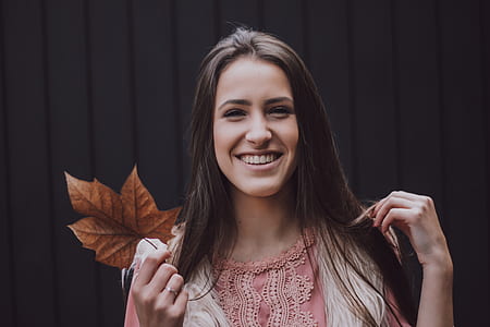 woman holding dried leaf thumbnail