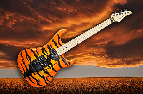 orange, black, and white tiger print stratocaster electric guitar thumbnail