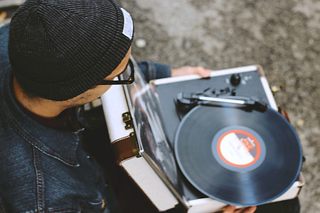 Man with a vinyl record player thumbnail
