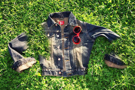 blue denim jacket on grass thumbnail
