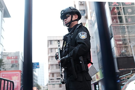 man holding assault rifle thumbnail
