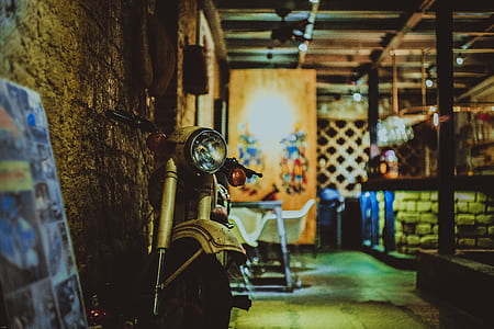 selective focus photography of motor scooter in room thumbnail