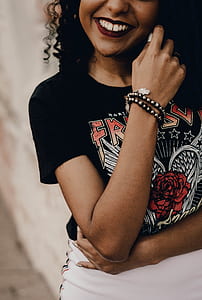 focus photography of woman wearing black shirt and white bottoms thumbnail