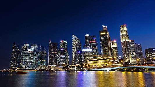 low-angle photography of high-rise building during night thumbnail