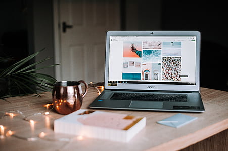 gray Acer laptop beside brown mug thumbnail