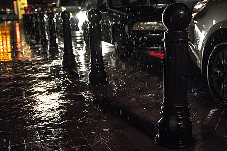 vehicles beside street during nighttime thumbnail