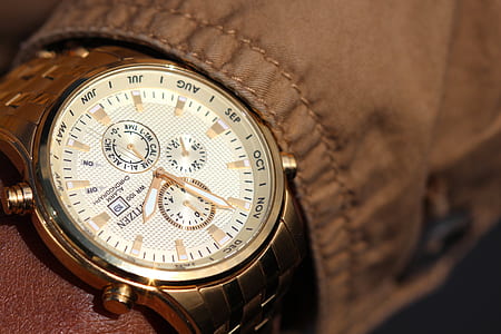 round gold-colored chronograph watch with link bracelet at 1:56 thumbnail