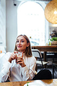 Pretty blonde woman sitting in the cafe thumbnail