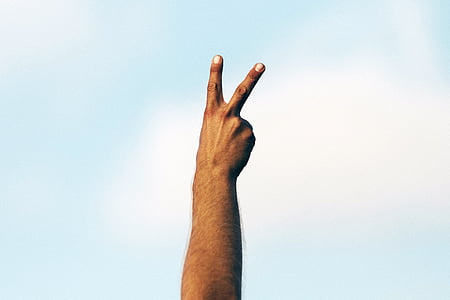 person's hand with peace sign thumbnail