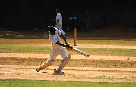 cricket player holding cricket bat during daytime thumbnail