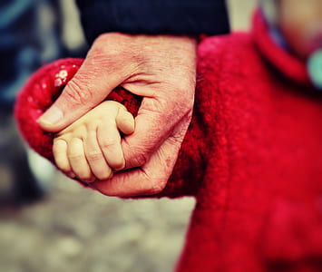 selective photography of person holding hands thumbnail