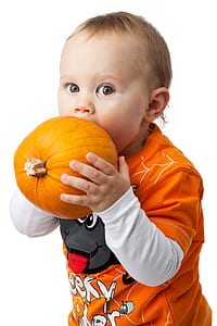 toddler about to bite pumpkin thumbnail