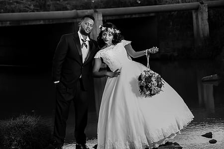 grayscale photo of groom and bride thumbnail