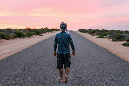 man walking on road thumbnail