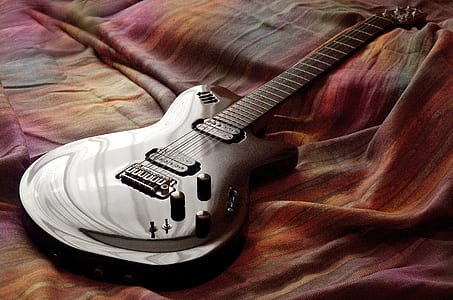 electric guitar on bed thumbnail