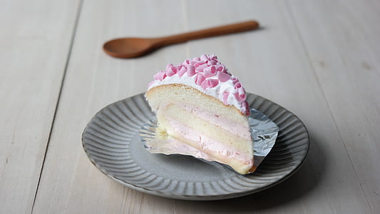 sliced of cake on round gray disposable plate thumbnail