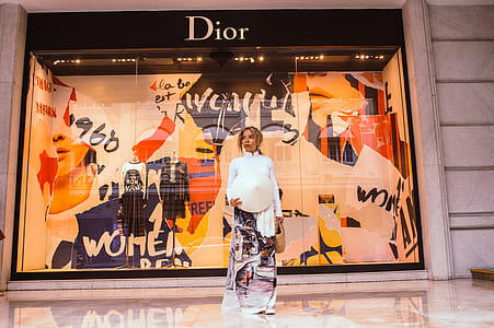 Woman Standing in Front of Dior Store Front thumbnail