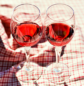 two wine glasses filled with red wine thumbnail