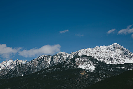 gray and black mountain under blue sky during daytime thumbnail