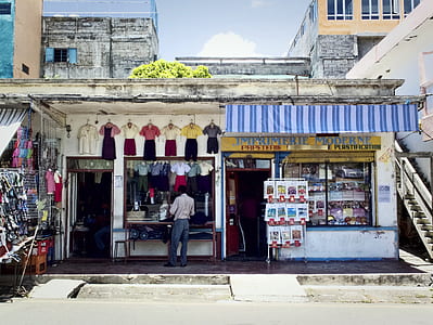 man standing in front of clothes store thumbnail