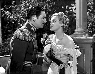 woman holding flowers beside man in grayscale thumbnail
