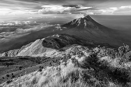 grayscale photography of mountain and clouds thumbnail