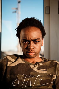 man in brown Nike shirt thumbnail