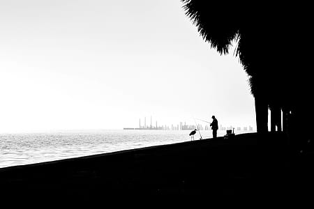 silhouette of man fishing thumbnail