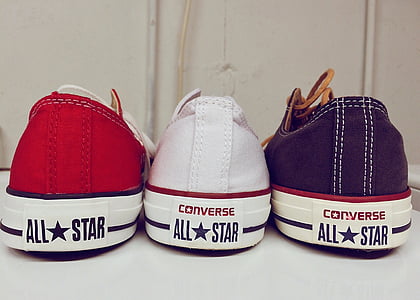 three unpaired Converse All Star sneakers thumbnail