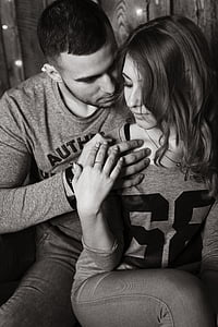 grayscale photo of man and woman in long-sleeved tops thumbnail