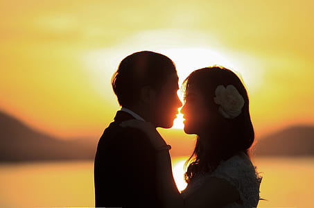 man and woman facing each other under sunset thumbnail