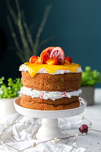 white icing covered cake with slice of fruits thumbnail