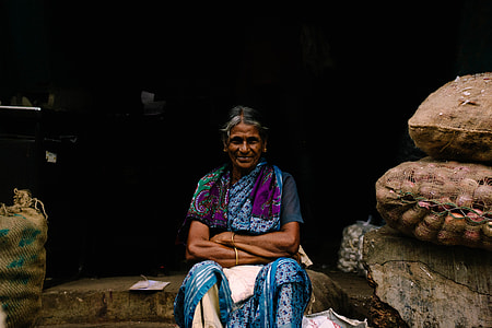 woman sitting on gray concrete floor thumbnail