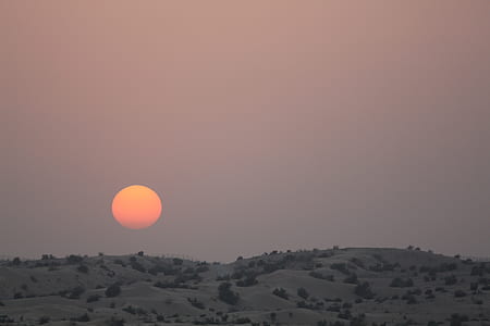 gray mountain covered with grass under sunset thumbnail