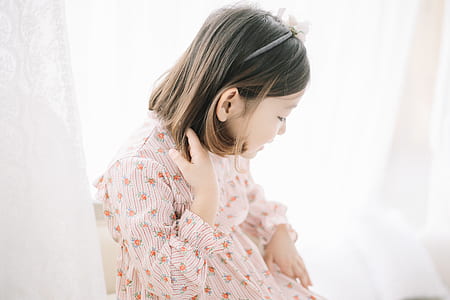 girl looking down inside room thumbnail