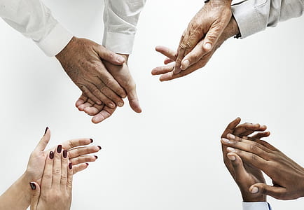 four person's hand clapping against white background thumbnail