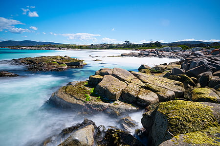 stones and body of water at daytime thumbnail