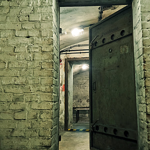 black metal door half open with lights turned-on inside thumbnail