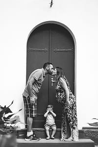 Greyscale Photo of Man and Woman Kissing thumbnail