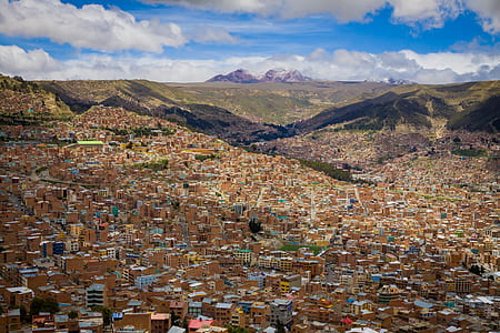 aerial view of concrete buildings near cliffs thumbnail