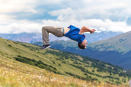 man wearing blue shirt doing backflips thumbnail