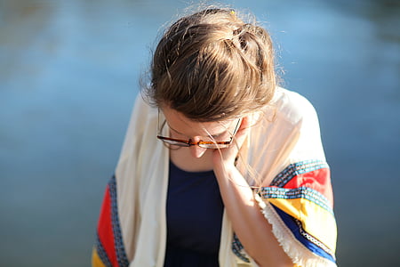 woman in sunglasses and white cardigan thumbnail